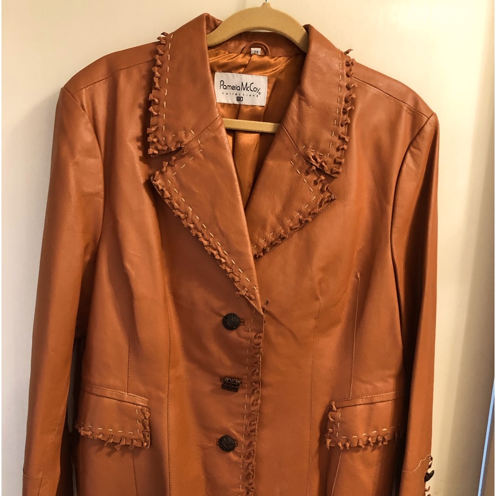Caramel leather jacket from Pamela McCoy, Size 2X, artsy button accents.